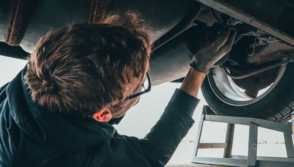 man-fixing-vehicle-engine-2244746