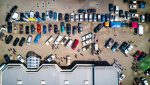 02 - photo-from-above-of-vehicles-parked-near-building-753876
